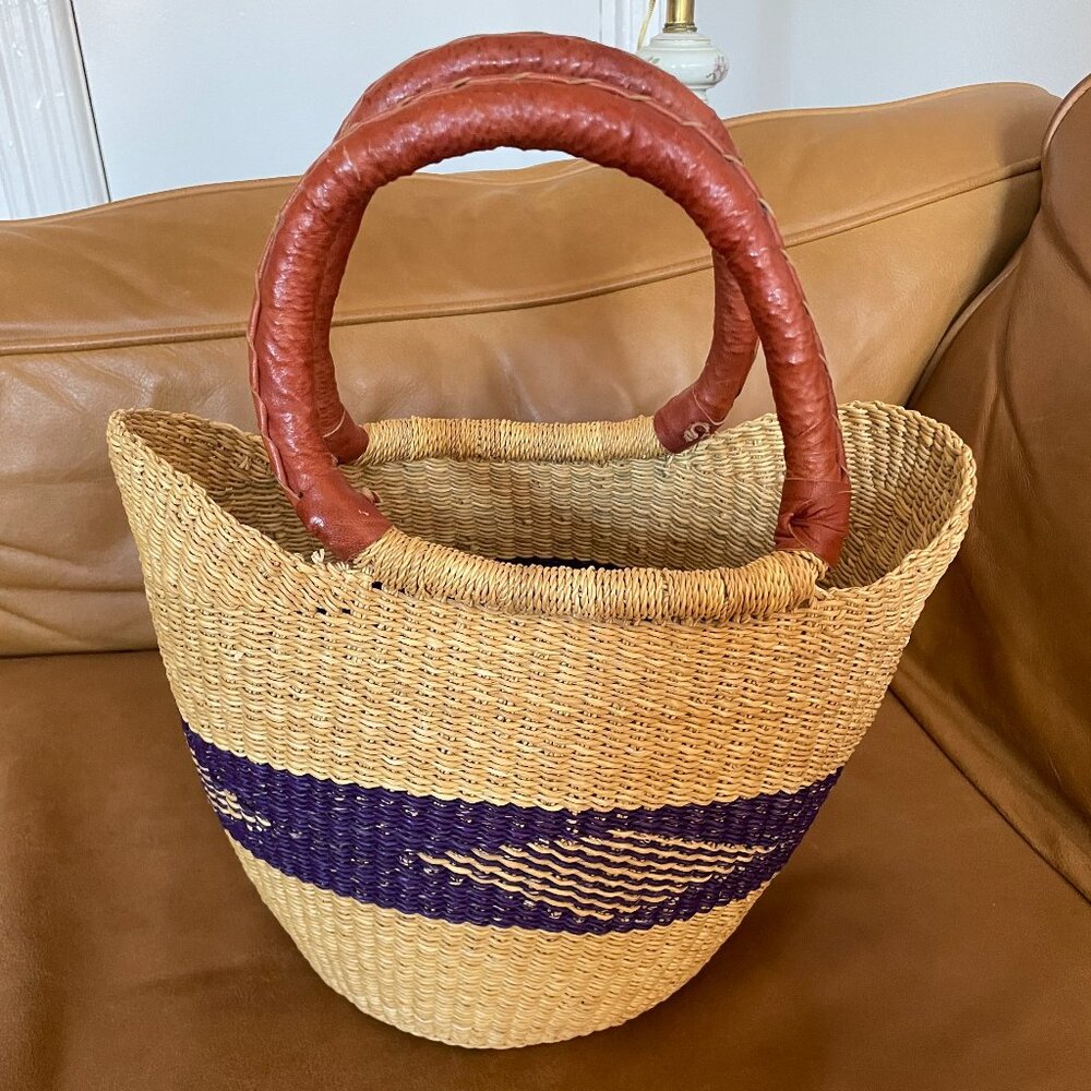 Beautiful woven bag with red straps and blue detailing